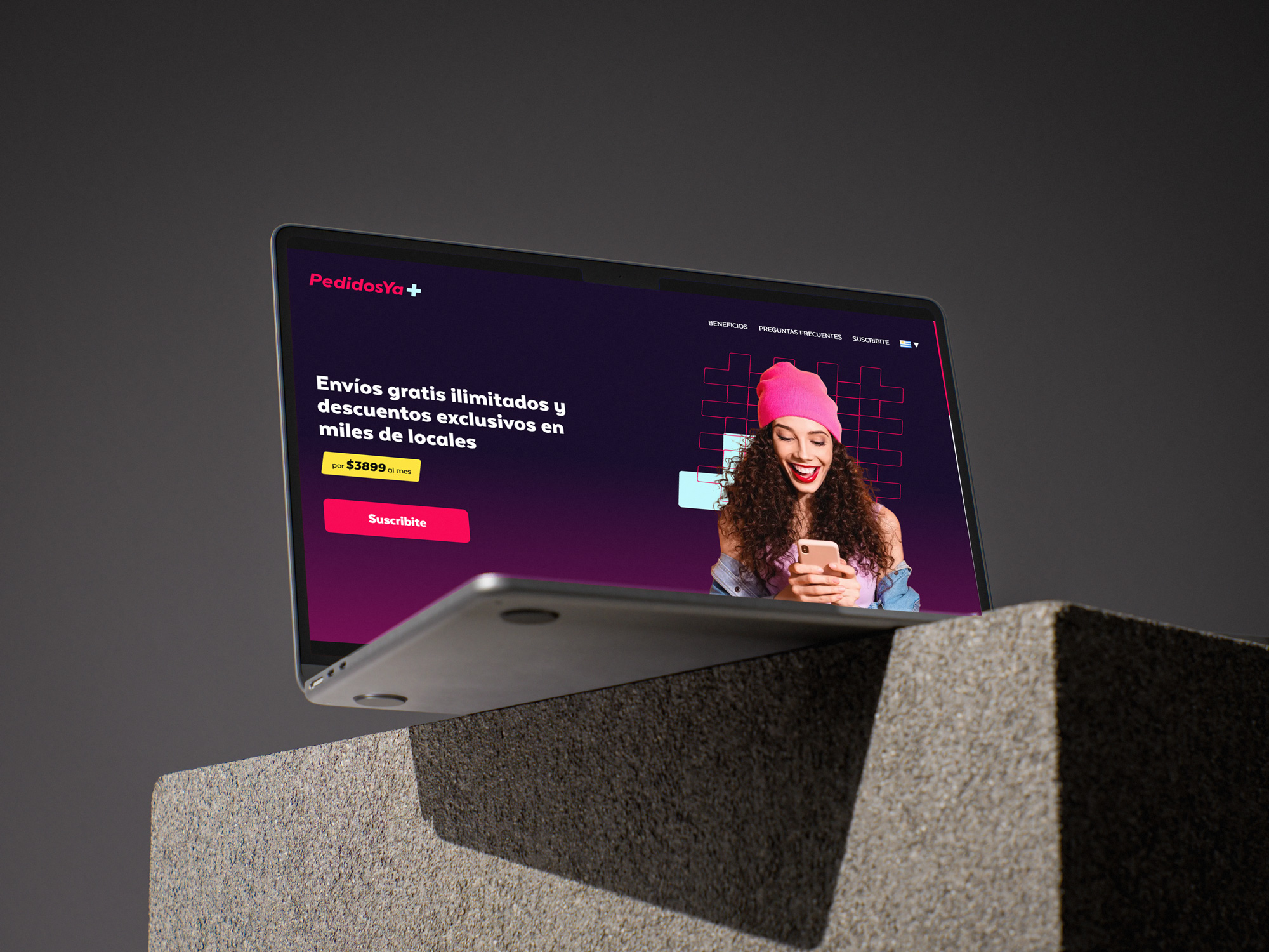 PedidosYa Plus subscription hero displayed on a laptop